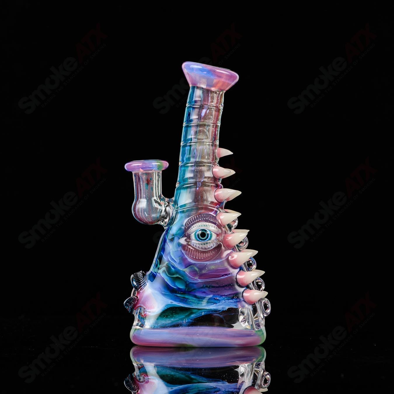 UV tie-dye Soul Flask glass by Nobody x SALT, a colorful concentrate rig with vibrant tie-dye design and clear glass accents.