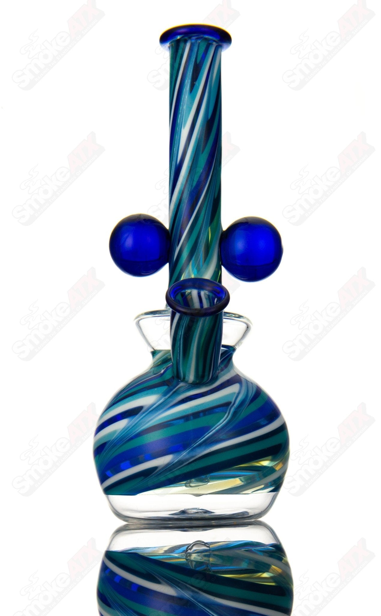 Venetian-style concentrate rig by Addison Hanna, made of heady glass with intricate design and colorful accents.