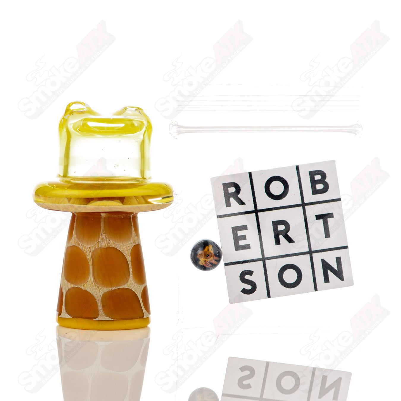 Yellow giraffe spinner cap with pearl detail, designed for Robertson Glass heady glass carb caps, shown on a clear glass piece.