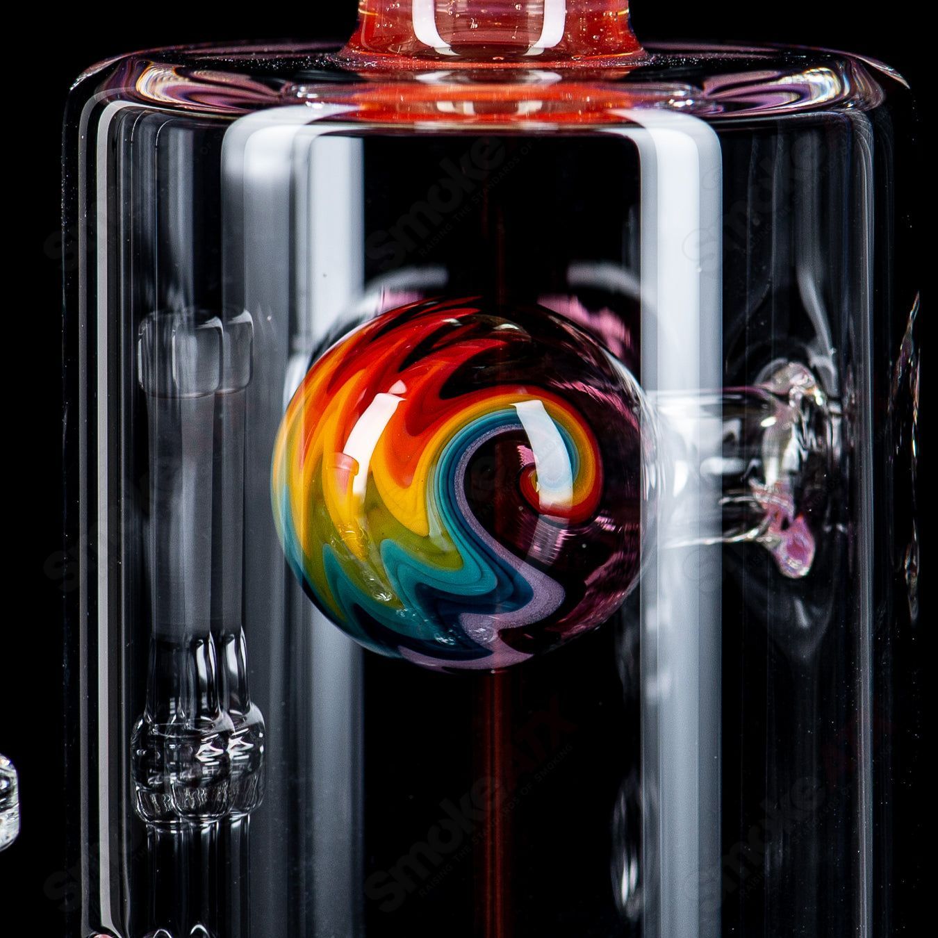 Colorful Toro Jetperc 10mm glass concentrate rig with a full-color foot and mouthpiece, featuring intricate heady glass design.