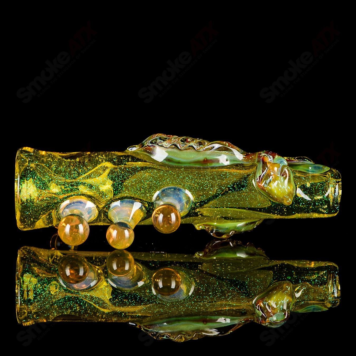 Handheld Mr. Gray Heady Glass Chillum pipe with a sleek, clear design and intricate glasswork, ideal for smoking.
