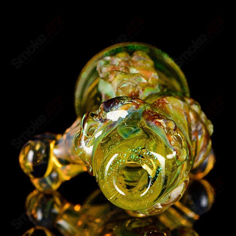 Handheld Mr. Gray Chillum from Heady Glass, featuring clear glass with colorful accents and a simple, smooth mouthpiece.