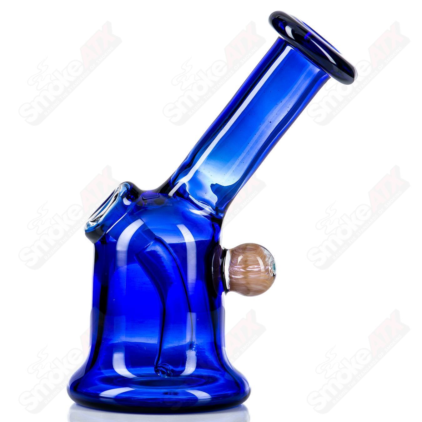 Cobalt glass layback rig by Nancy Glass, featuring a sleek, curved design and glass accessories for dabbing or vaporizing.