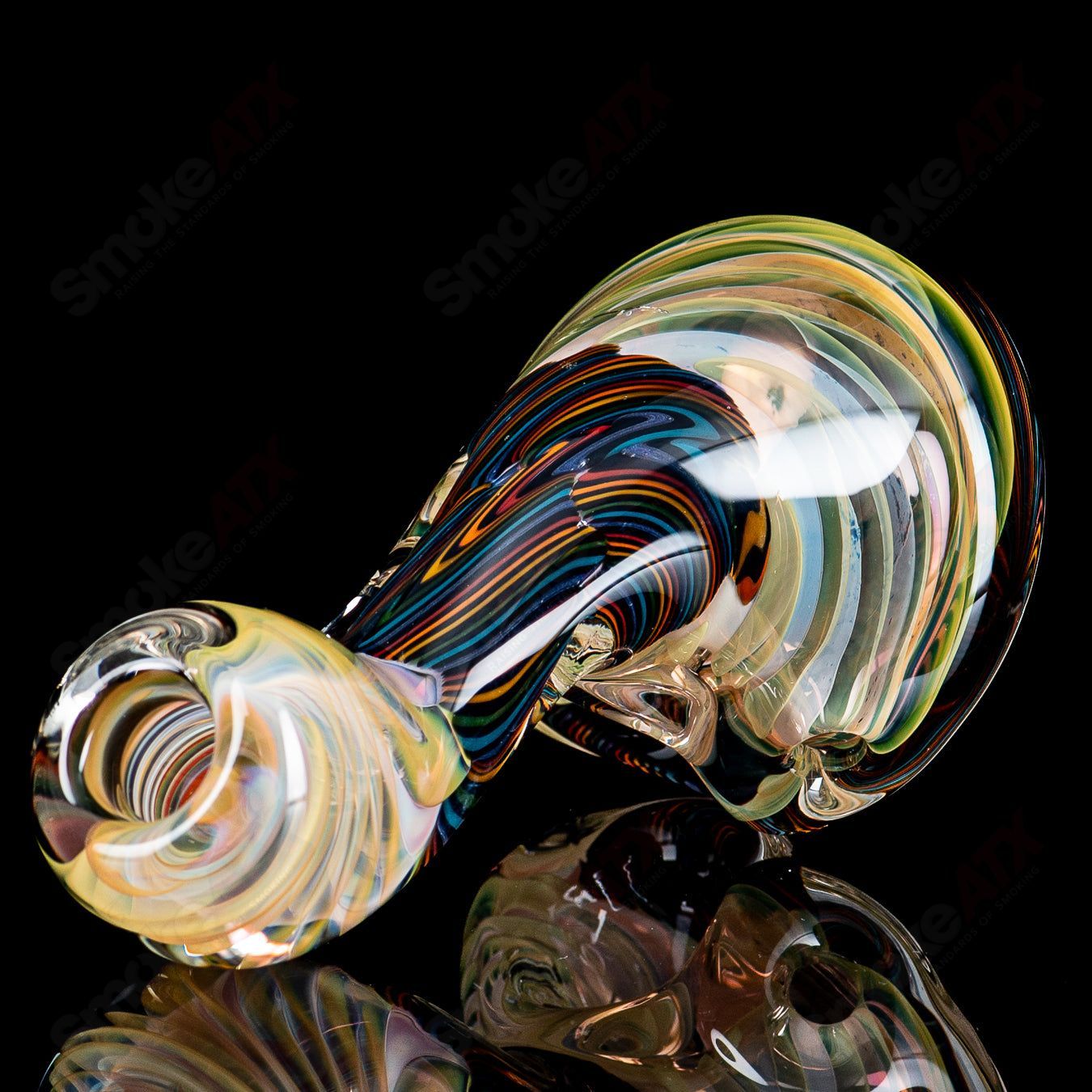 Color coil Sherlock glass by Talent Glass Works featuring vibrant swirl design and clear glass construction.