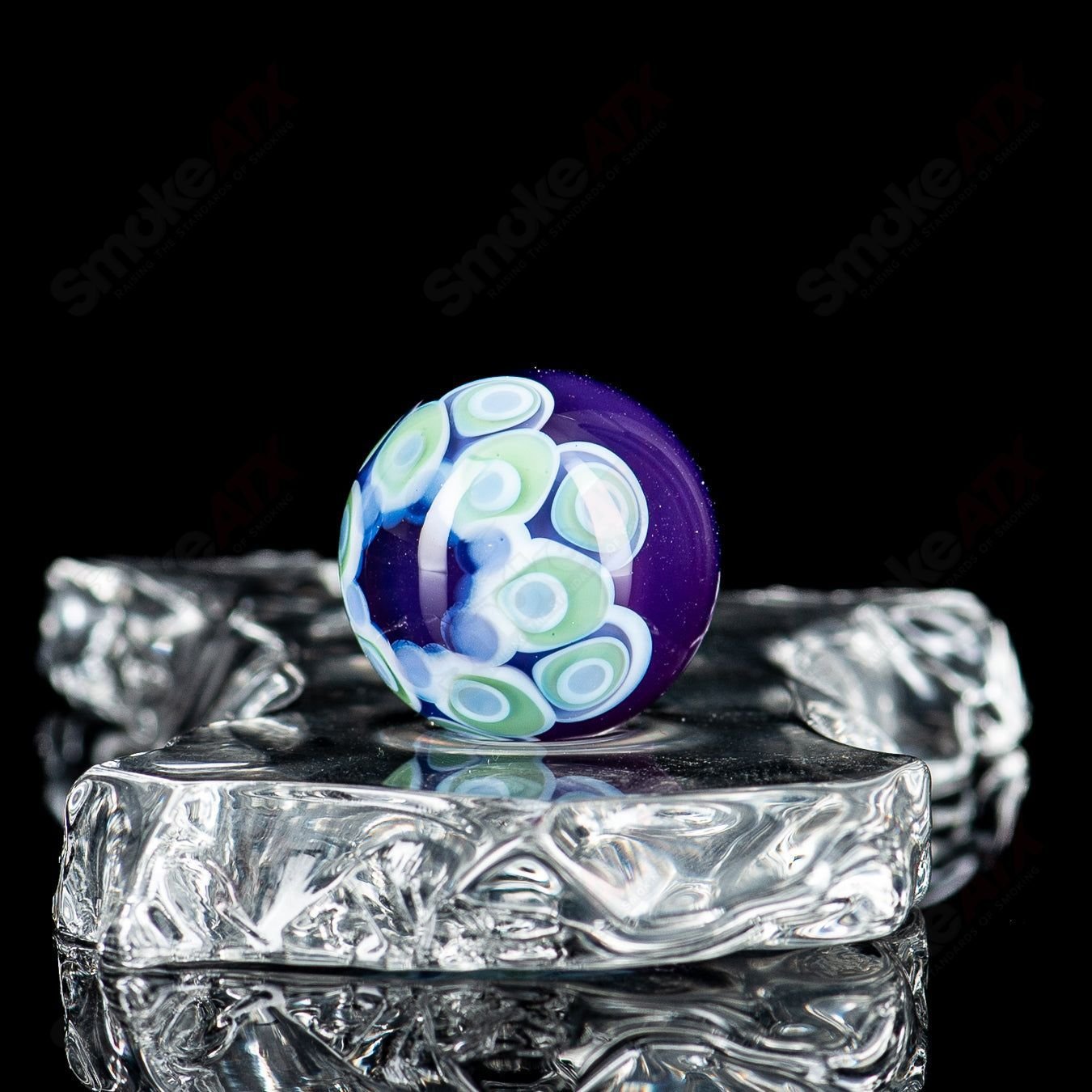 Glass marble from Indo Glass with a stacked top dot design, part of the #1 Dot Stacked Top MIB collection, featuring vibrant colors.