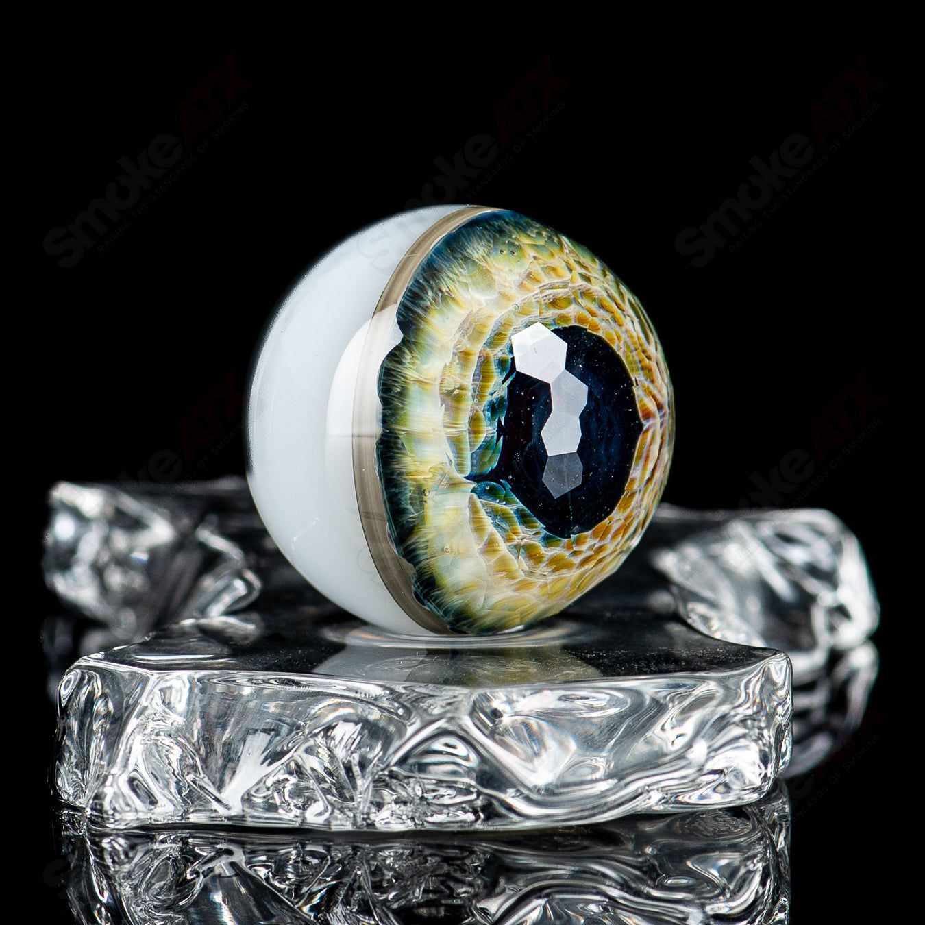 Faceted Eye Marble by Indo Glass, part of Fatal Facets heady glass marbles, featuring intricate faceted eye design in vibrant colors.