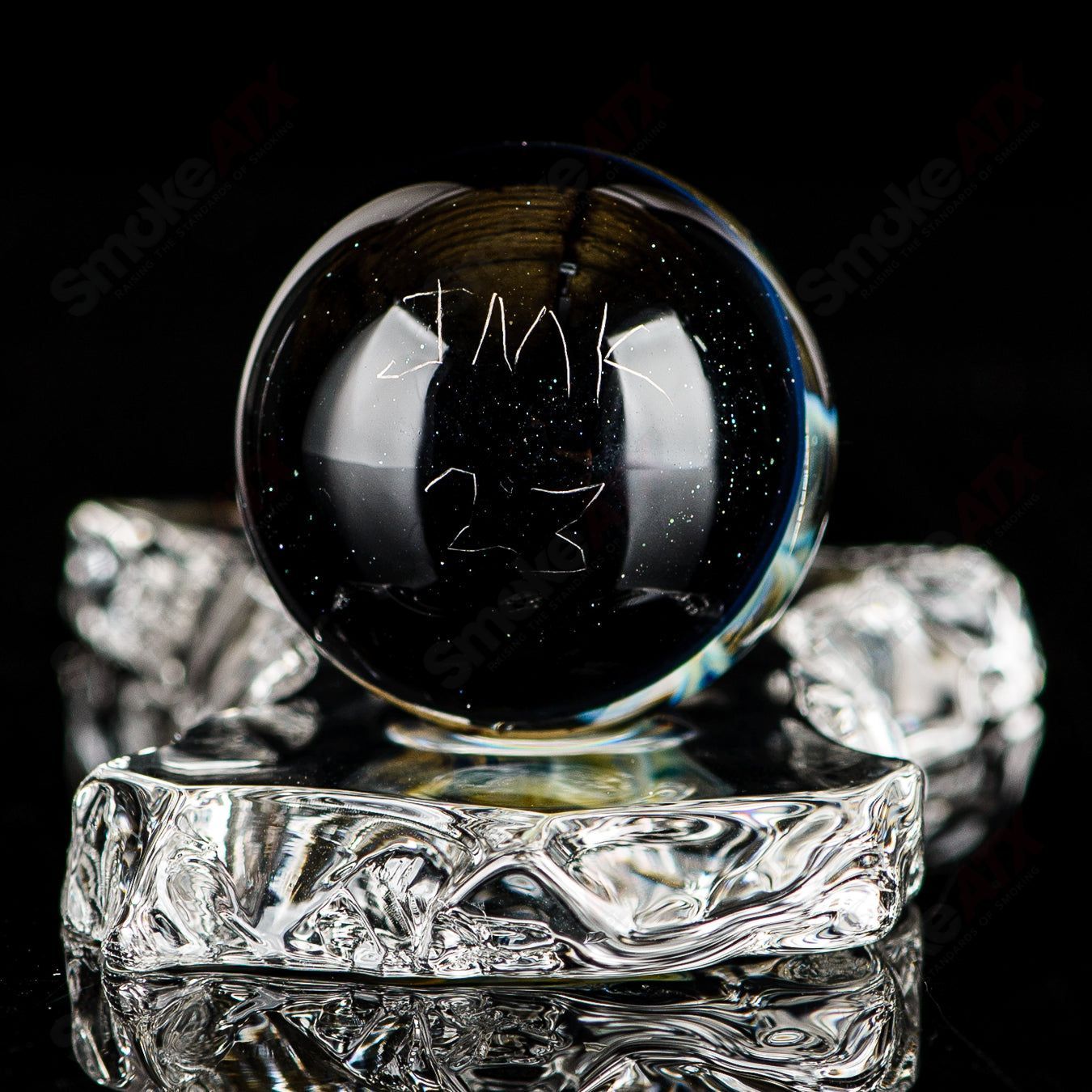 Fume Latticino marble signed by JMK Glass, colorful heady glass marble with intricate swirled patterns and signature detail.