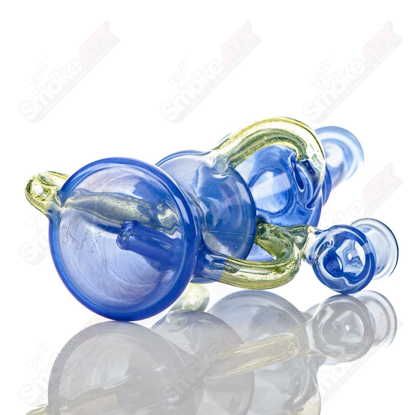 Captn Chronic Mini Two & Through CFL Recycler in heady glass with intricate design and glass recycler tube for smooth filtration.