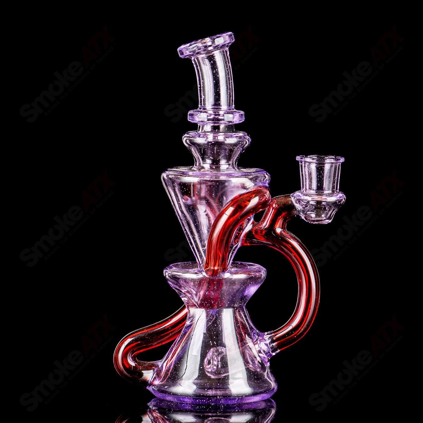 Mini Two & Through Recycler by Captn Chronic, heady glass pipe with intricate design and clear glass construction.