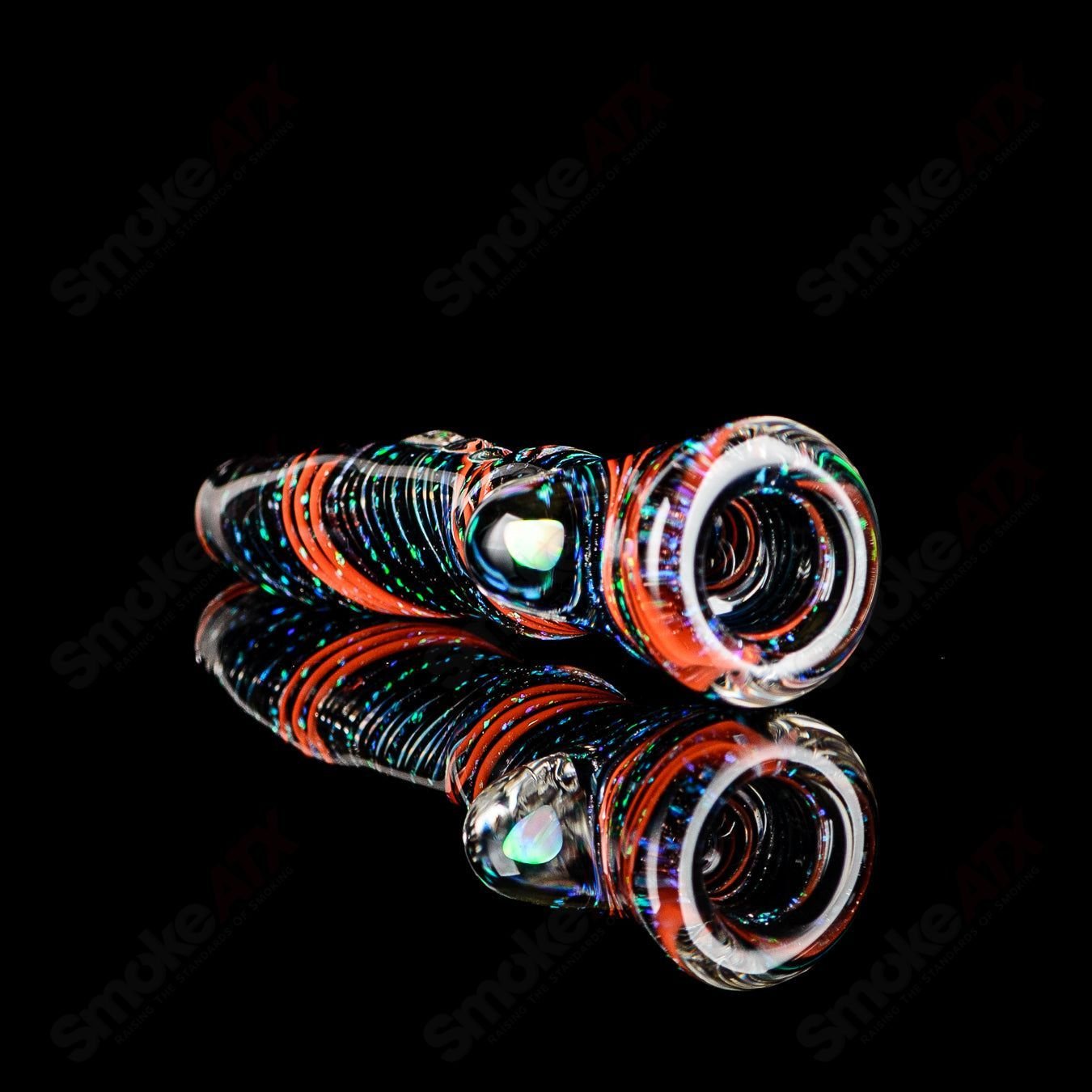 Glass chillum named Opal Hitter by Rotational Science, featuring a colorful opal design on a sleek glass smoking pipe.