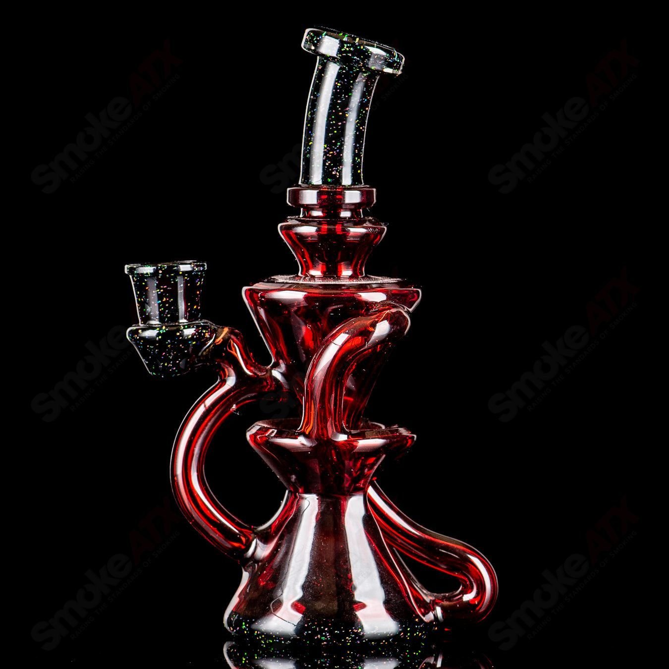 Captn Chronic heady glass concentrate rig with pomegranate and black crushed opal design, compact and colorful for dabbing.