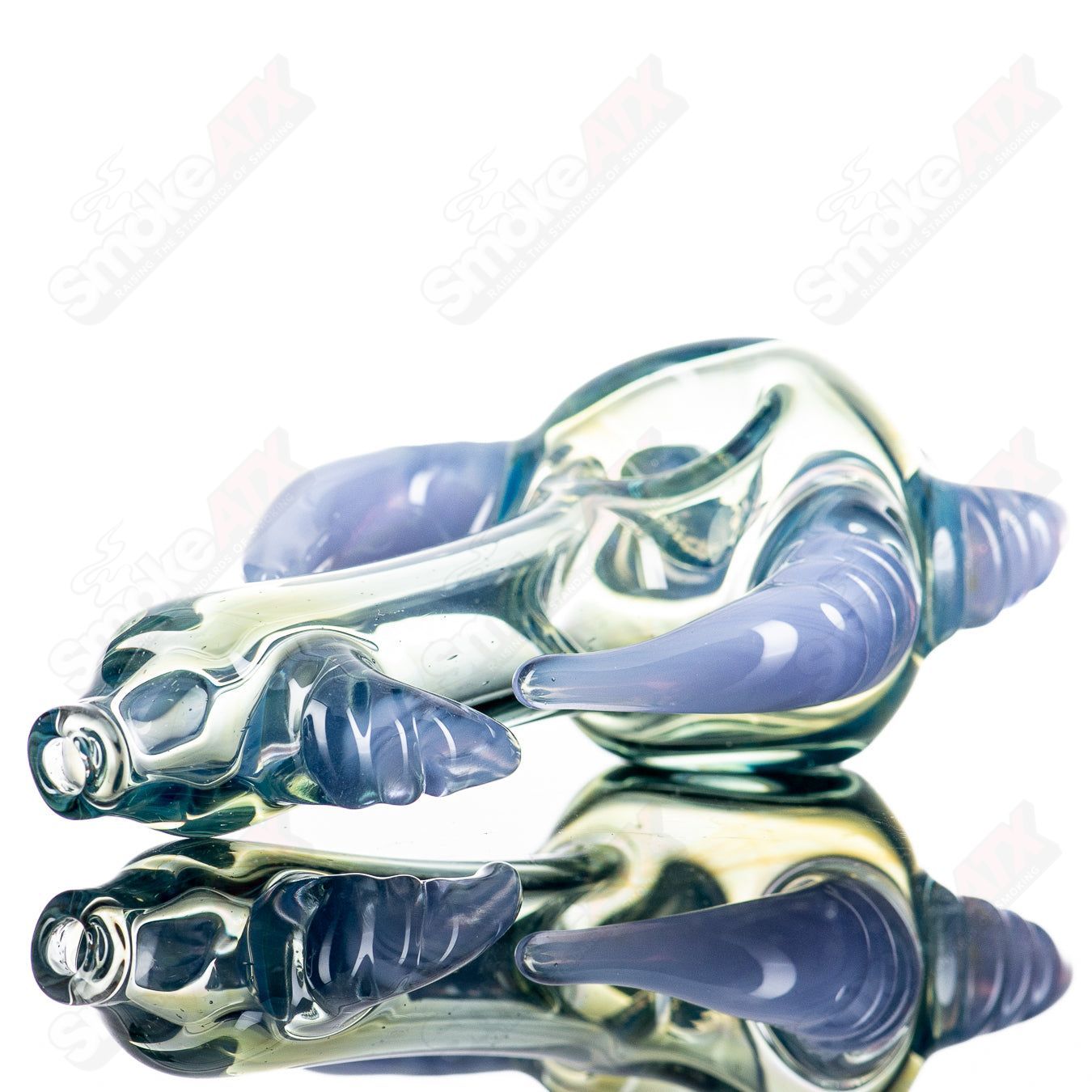 JMK Glass Sceptre Steam Roller Spoon made of clear glass, featuring intricate designs and a functional hand pipe shape.