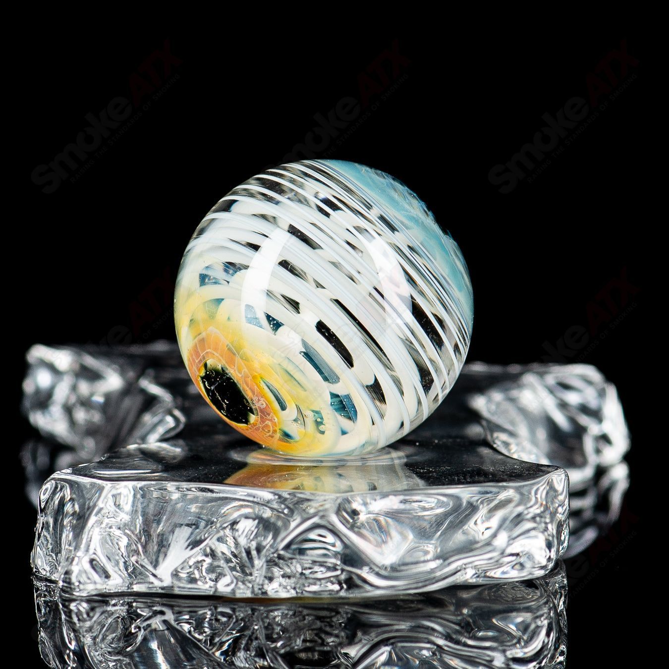 Indo Glass Skull Eye Mili Top Mib heady glass with colorful marble accents and detailed skull and eye design.
