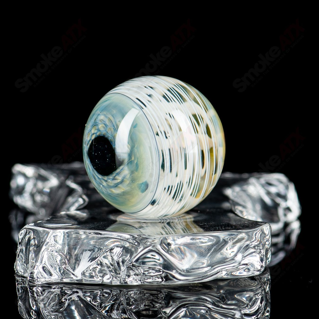 Colorful Skull Eye Mili Top heady glass with intricate marble design by Indo Glass, featuring vibrant patterns and detailed craftsmanship.