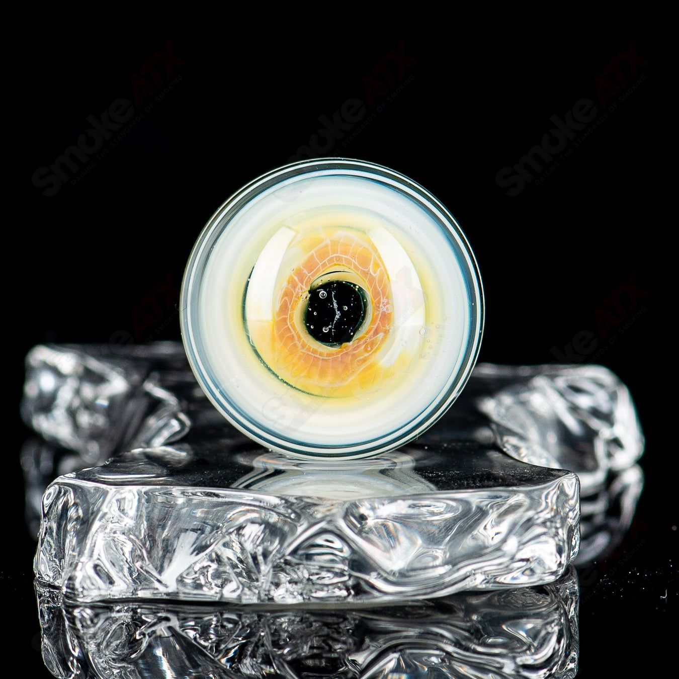 Indo Glass Skull Eye Mili Top Mib heady glass pipe with colorful marbles and skull eye design, showcasing intricate glass art details.