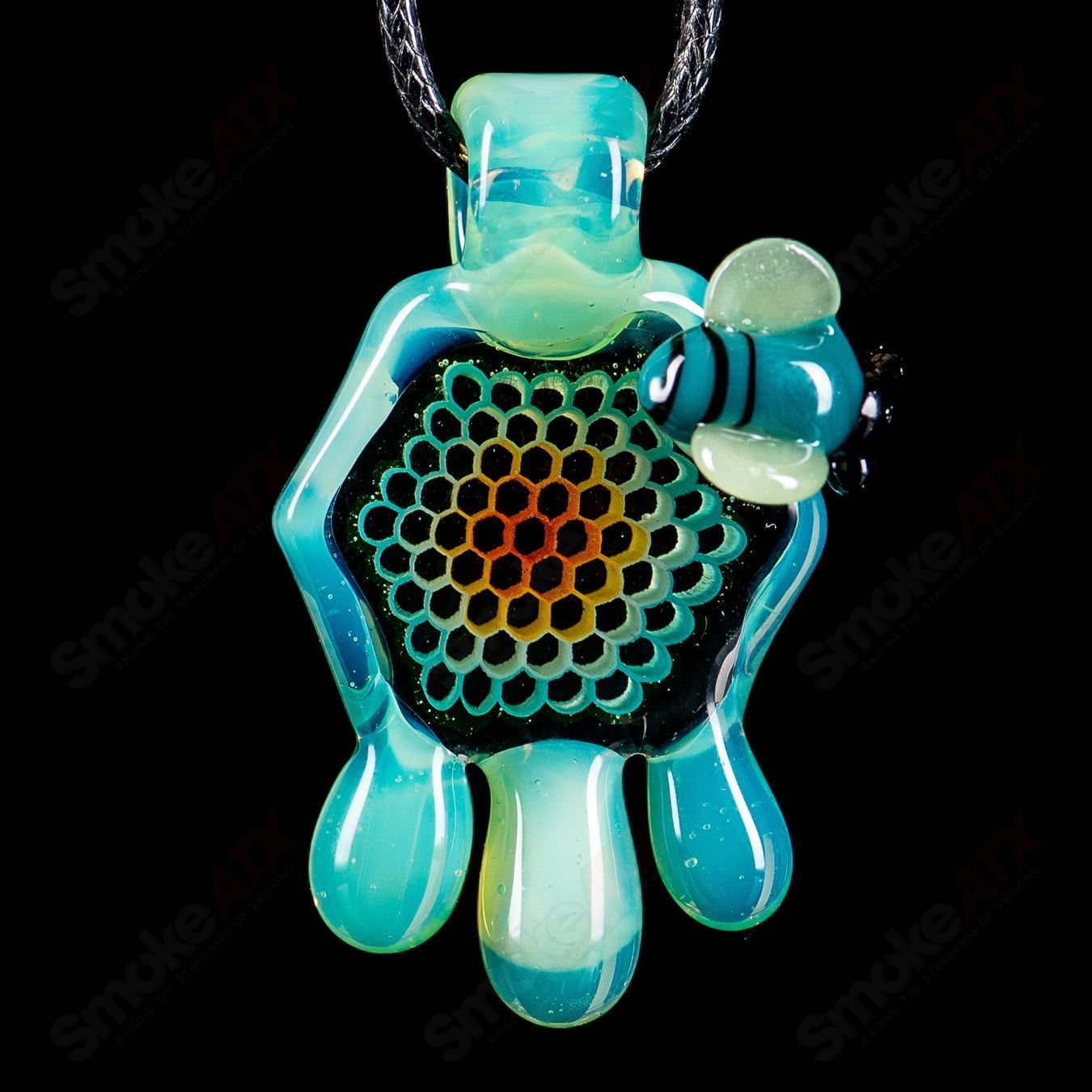 Small color honeycomb drip pendant by Joe P Glass, crafted with vibrant glass and intricate honeycomb design.