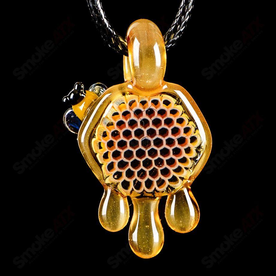 Small honeycomb drip pendant from Joe P Glass, handcrafted heady glass jewelry with intricate honeycomb design.