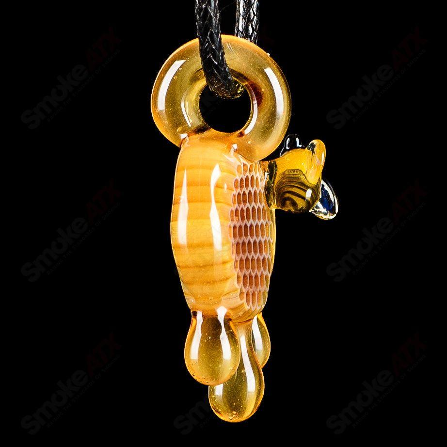 Small honeycomb drip pendant by Joe P Glass, handcrafted heady glass jewelry with intricate honeycomb design.
