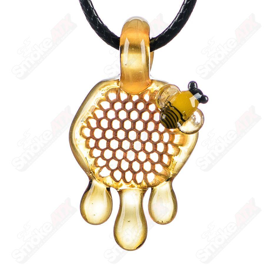 Small honeycomb drip pendant by Joe P Glass, handcrafted heady glass jewelry with intricate honeycomb design.