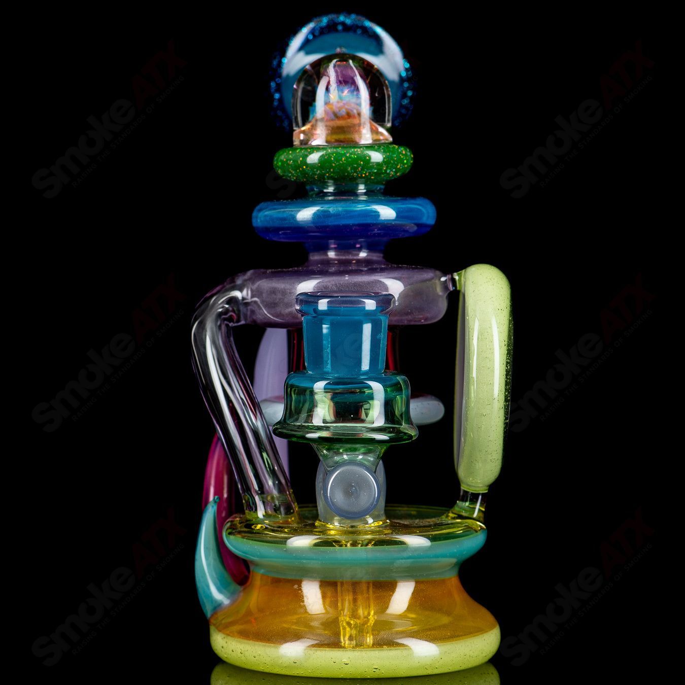 Freeek Glass Terpcycler Recycler Rig featuring vibrant heady glass design and intricate recyclers for smooth dabbing.