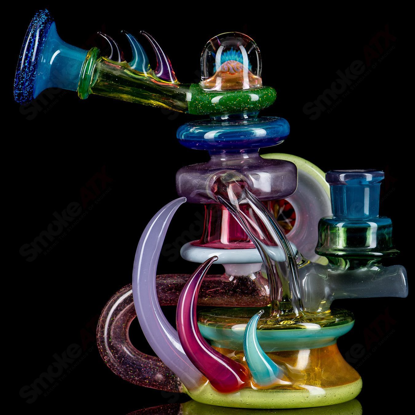 Freeek Glass Terpcycler Rig, a heady recycler glass water pipe with intricate design and clear glass construction.