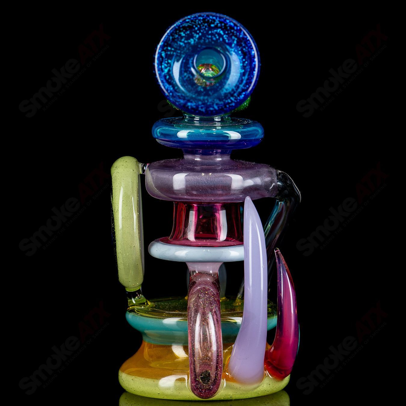 Freeek Glass Terpcycler Rig, a heady recycler glass piece with intricate glasswork and a clear design, designed for concentrate use.