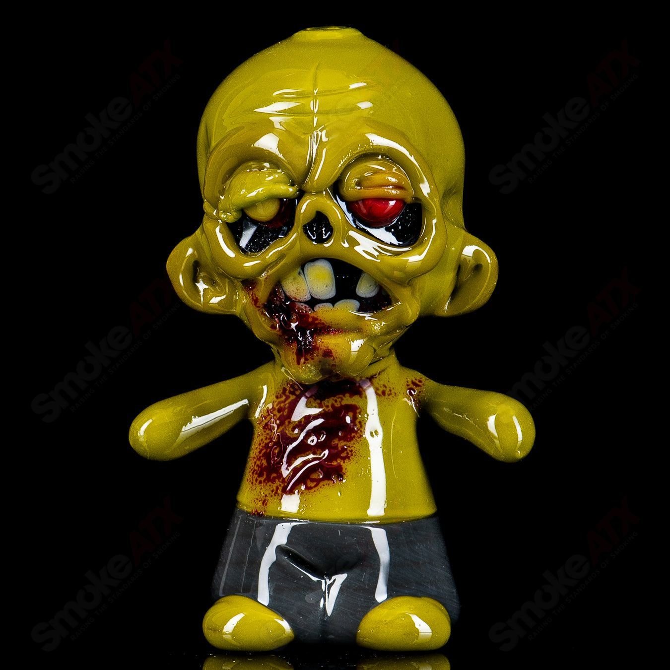 Zombie hand pipe by Ghost, a heady glass hand pipe featuring detailed zombie design and vibrant colors.