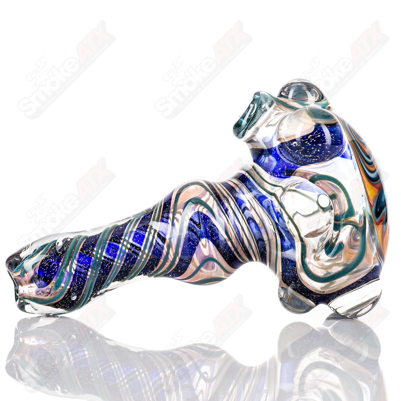 Molten Imagination #10 ISO Dichroic UV Spoon showing iridescent, color-shifting glass with a smooth, rounded shape.