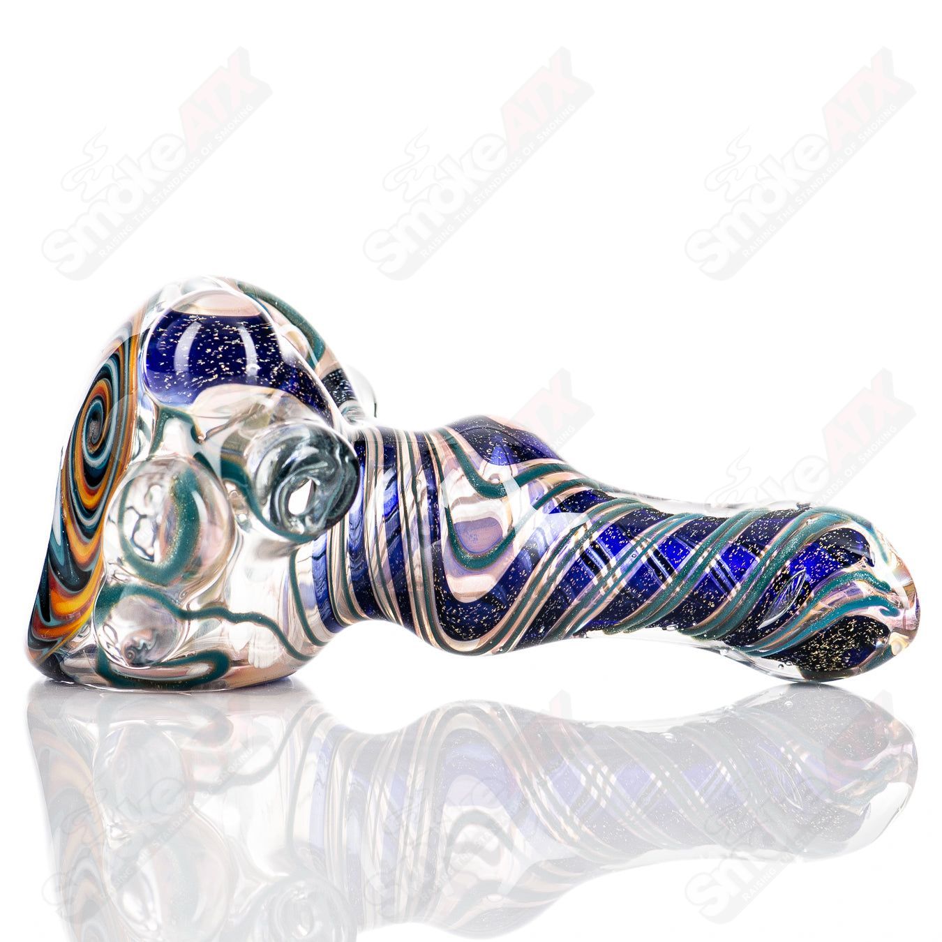 Molten Imagination #10 ISO Dichroic UV Spoon showing colorful, reflective glass with iridescent hues under UV light.