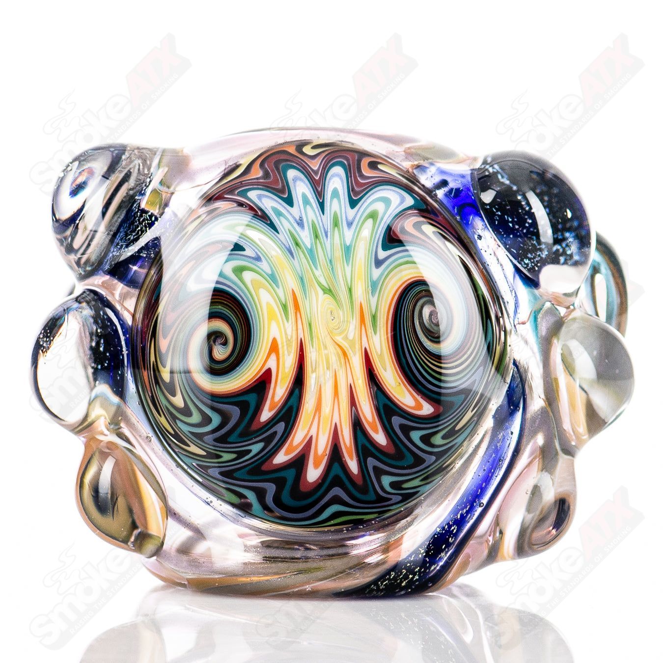 Molten Imagination #10 ISO Dichroic UV Spoon showcasing colorful, reflective glass with vibrant iridescent hues in close-up view.
