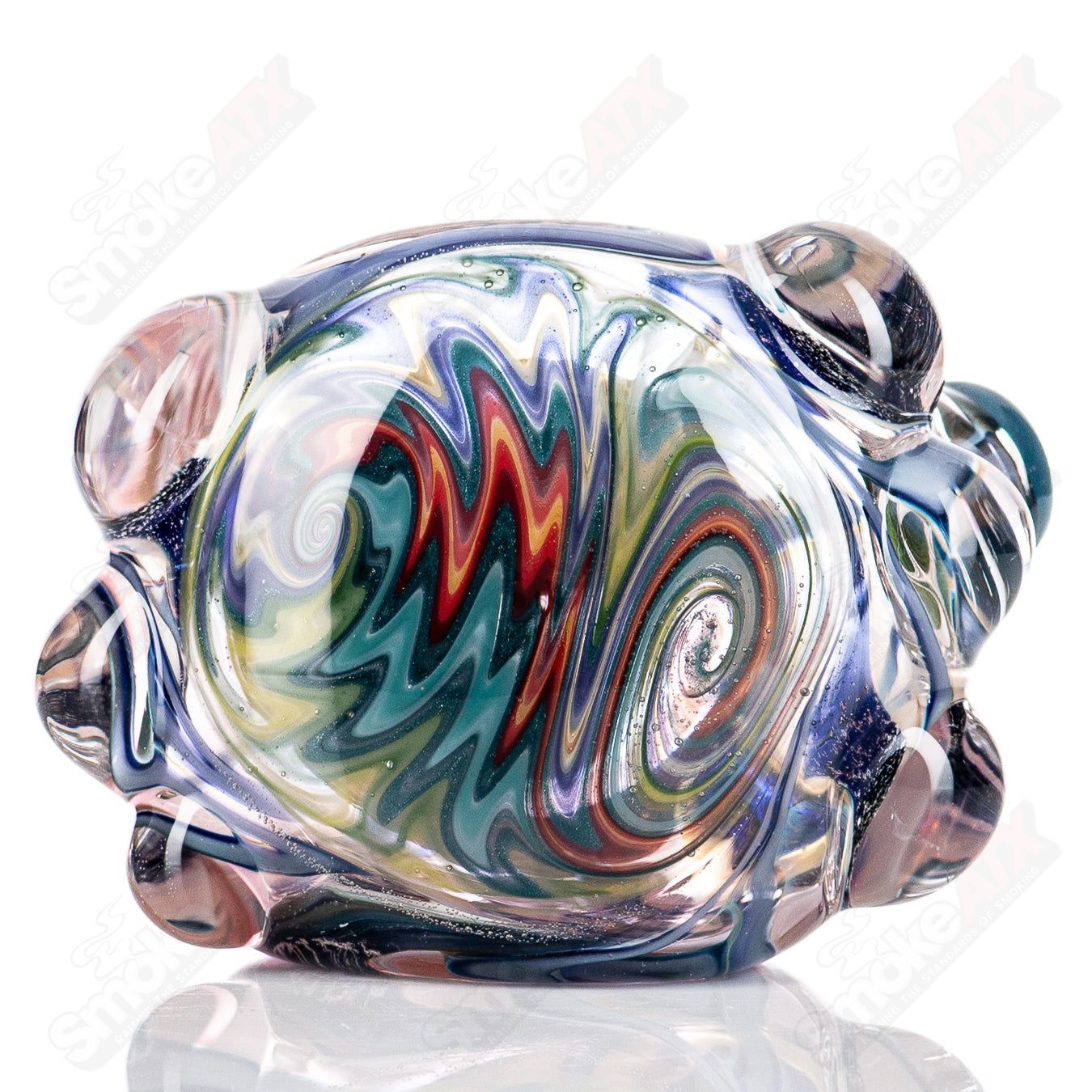 Molten Imagination #10 ISO Dichroic UV Spoon showing colorful iridescent glass with a curved, spoon-shaped design.