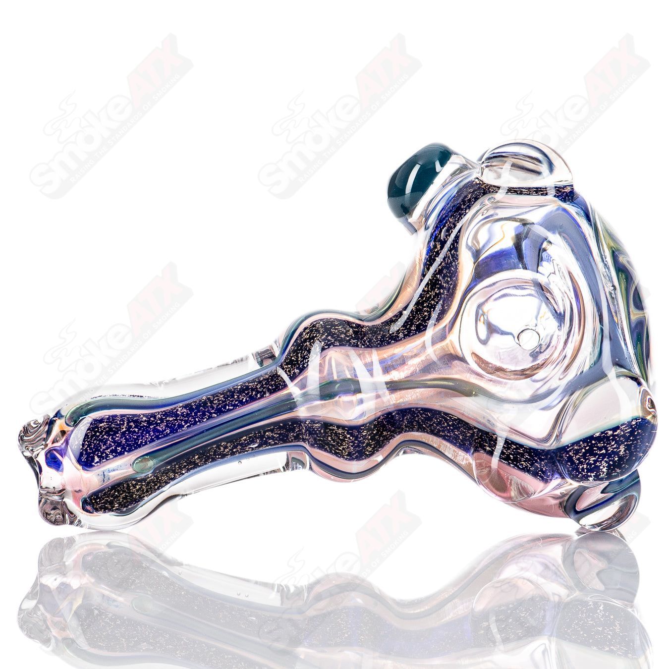 Molten Imagination #10 ISO Dichroic UV Spoon showing a colorful, reflective glass tool with iridescent finish under UV light.
