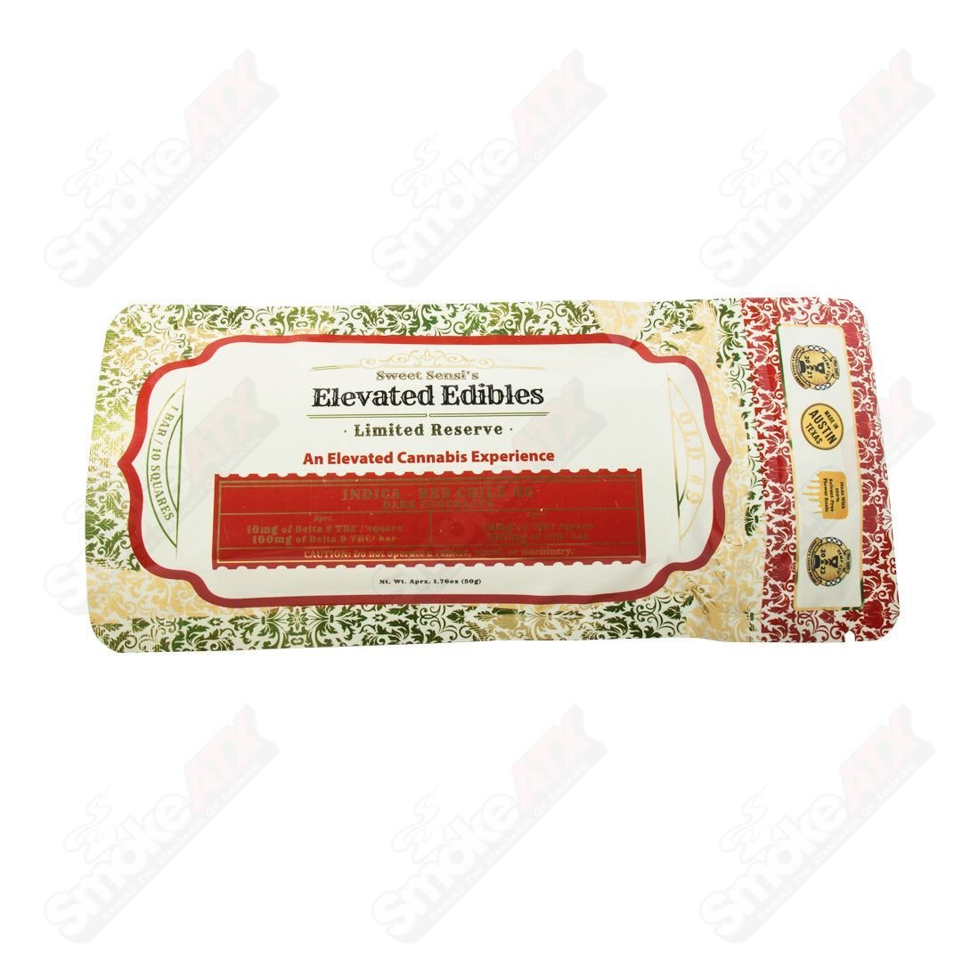 Dark chocolate square of Sweet Sensi 100mg D9 Red Chile OG hemp edibles with red chili flavor and rich chocolate appearance.