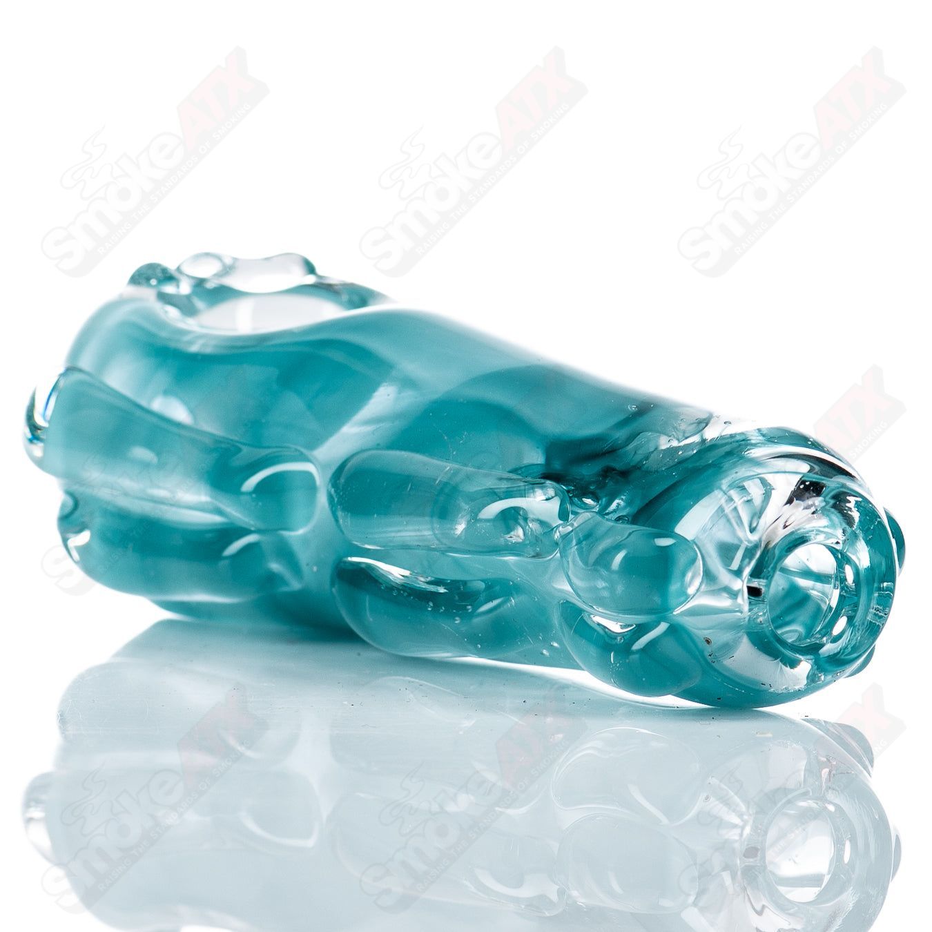 Spoon-shaped glass pipe by Nobody with clear glass and smooth curves, designed for smoking purposes.