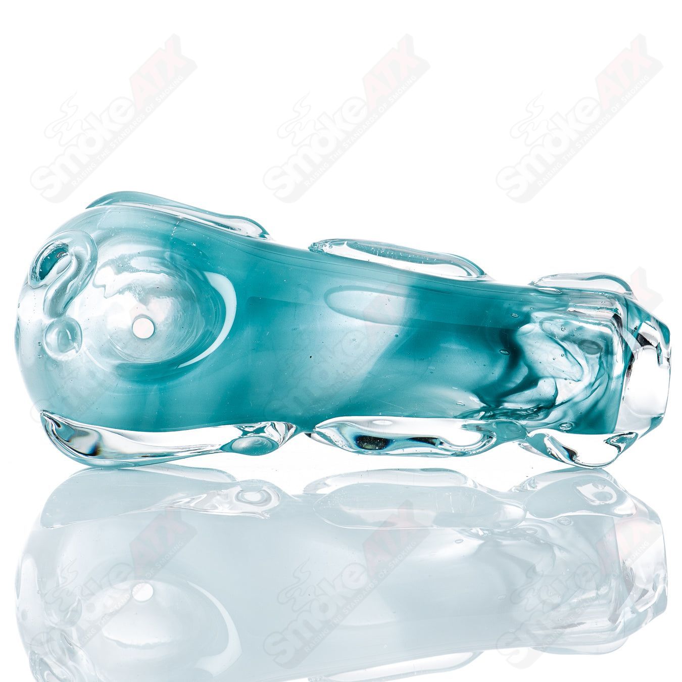 Spoon glass pipe by Nobody, clear glass with a rounded bowl and elongated stem, designed for smoking purposes.