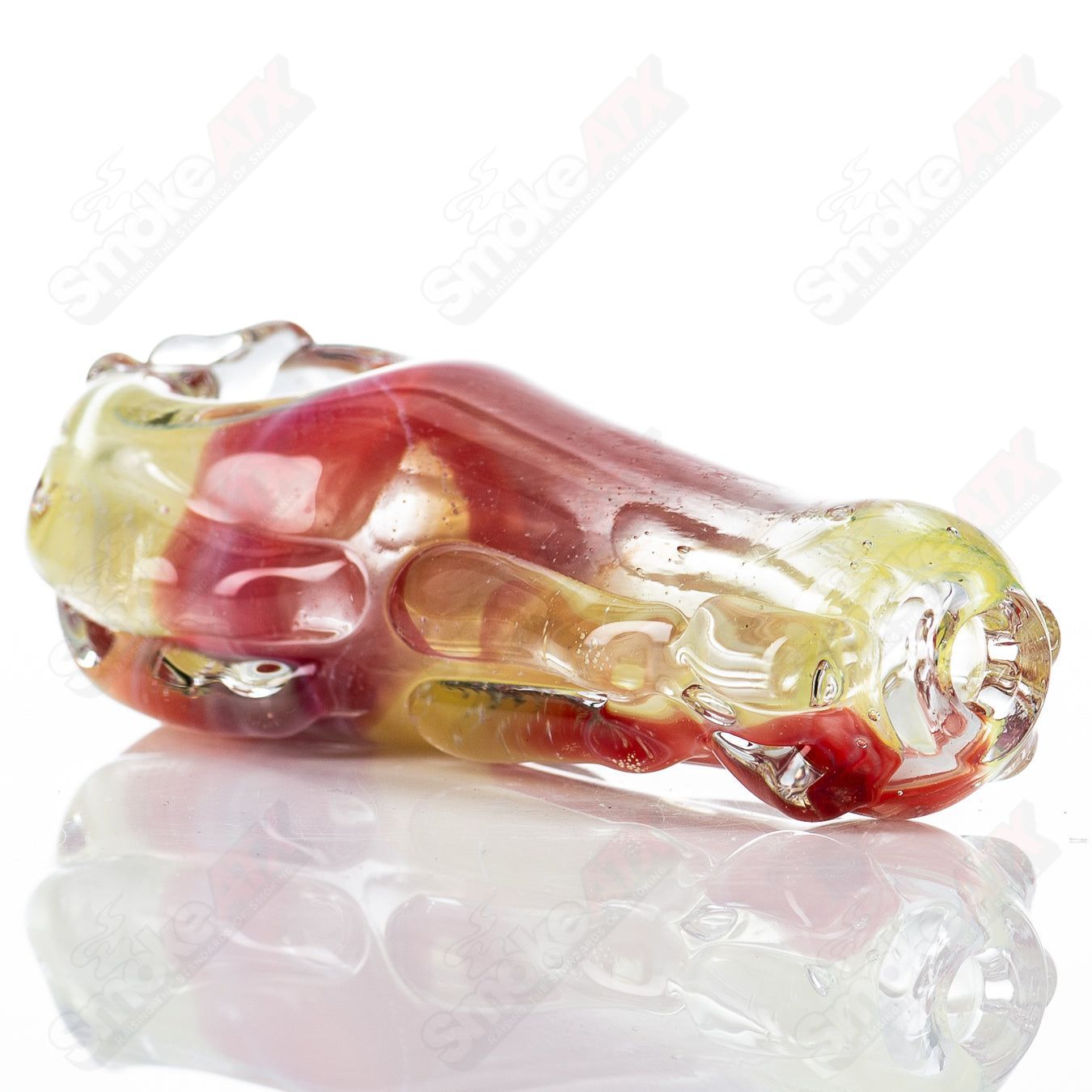 Clear glass spoon pipe by Nobody with a smooth, rounded bowl and a straight stem, designed for smoking.