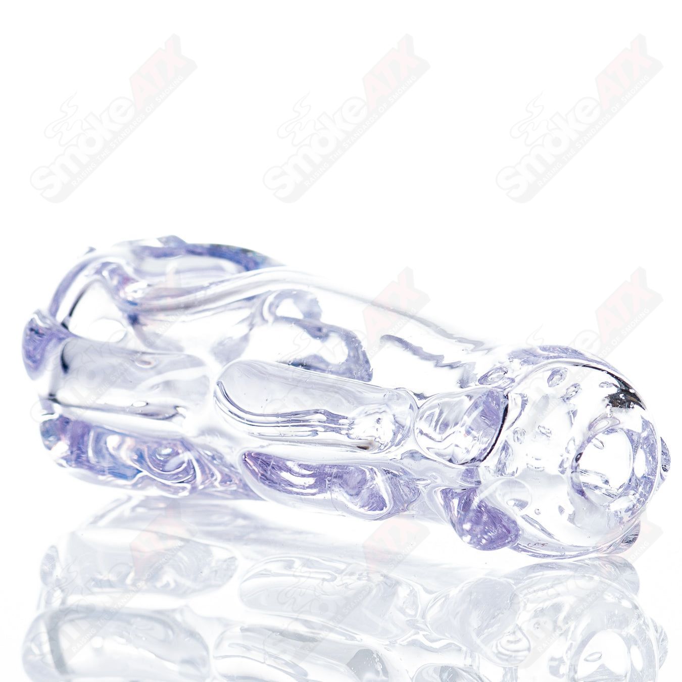 Glass pipe titled Spoon Glass by Nobody, featuring a clear glass design with a rounded bowl and long stem for smoking.