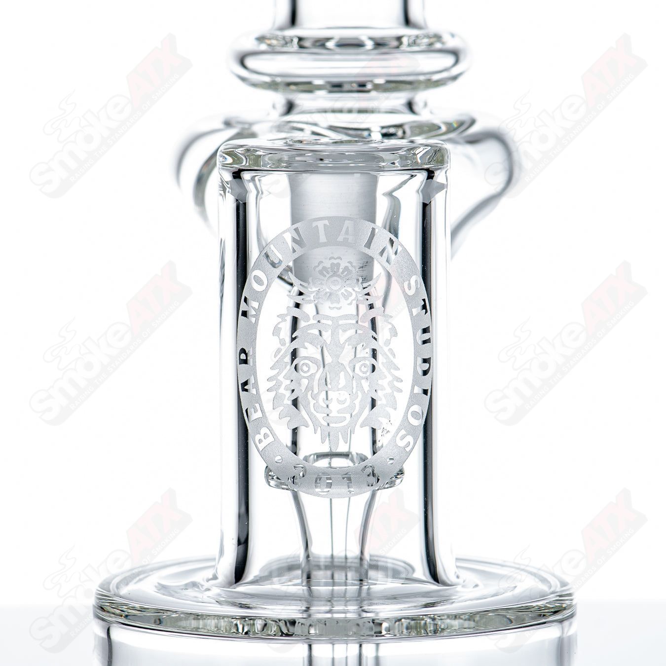 Mini 10mm double diffused RBR concentrate rig by Bear Mountain Studios, featuring clear glass with colorful accents.