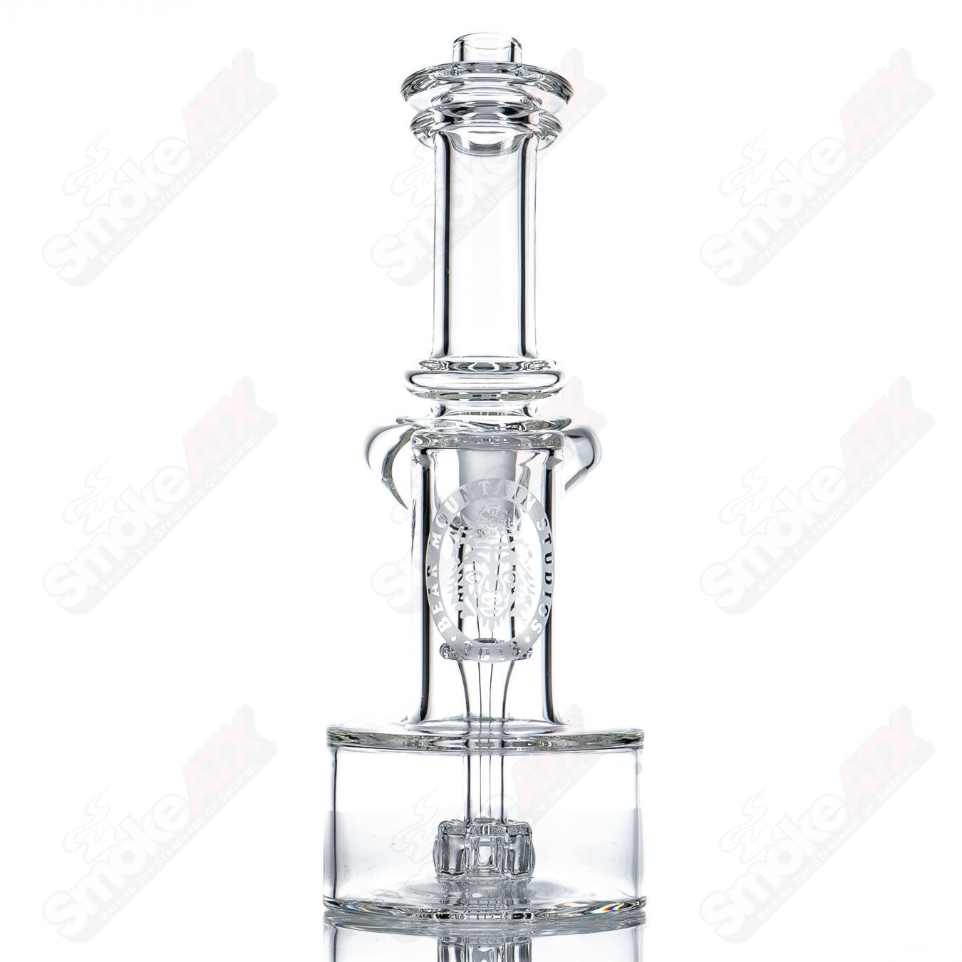 Mini 10mm double diffused RBR concentrate rig by Bear Mountain Studios, clear heady glass with intricate design and percolation features.