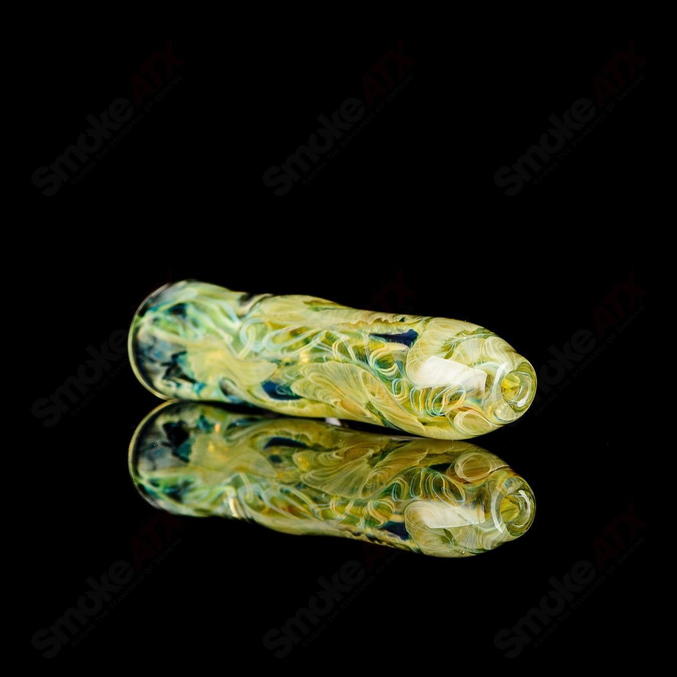 JMK Glass signed I/O Worked Chillum made of clear glass with intricate worked design, small hand-held smoking pipe.