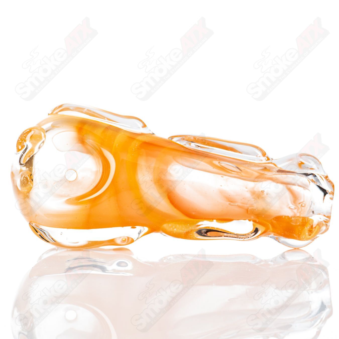Spoon-shaped glass pipe by Nobody featuring clear glass with smooth curves, designed for smoking.