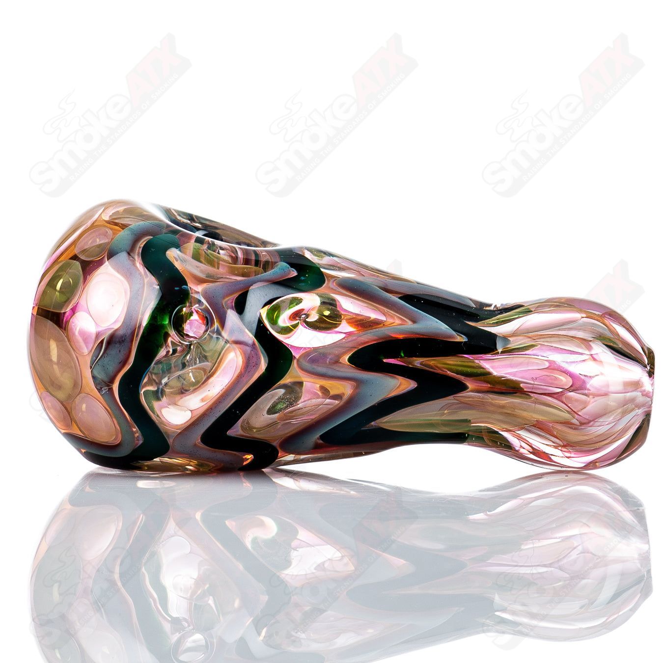 Gold and silver fume I/O glass spoon pipe by Shane Smith, featuring intricate metallic accents and a smooth, rounded bowl.