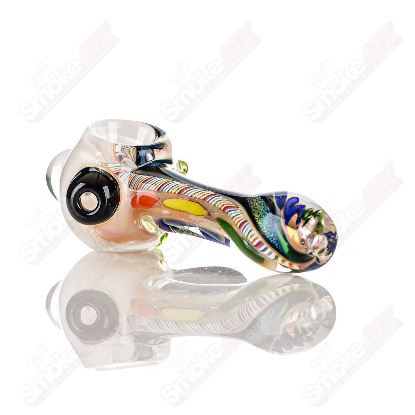 Colorfully worked IO spoon hand pipe by Jeremy from Oregon featuring 14 vibrant colors and intricate glass design.