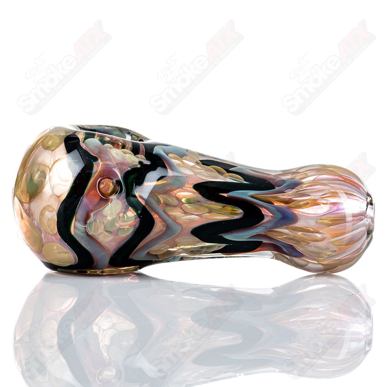 Gold and silver fume I/O spoon pipe by Shane Smith, made of glass, with intricate metallic accents and a smooth bowl design.