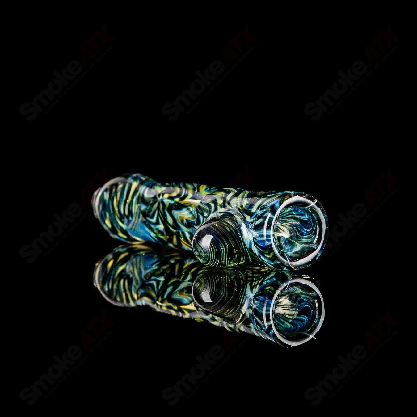 Signed JMK Glass I/O Worked Chillum made of clear glass with intricate worked details and a signature mark.