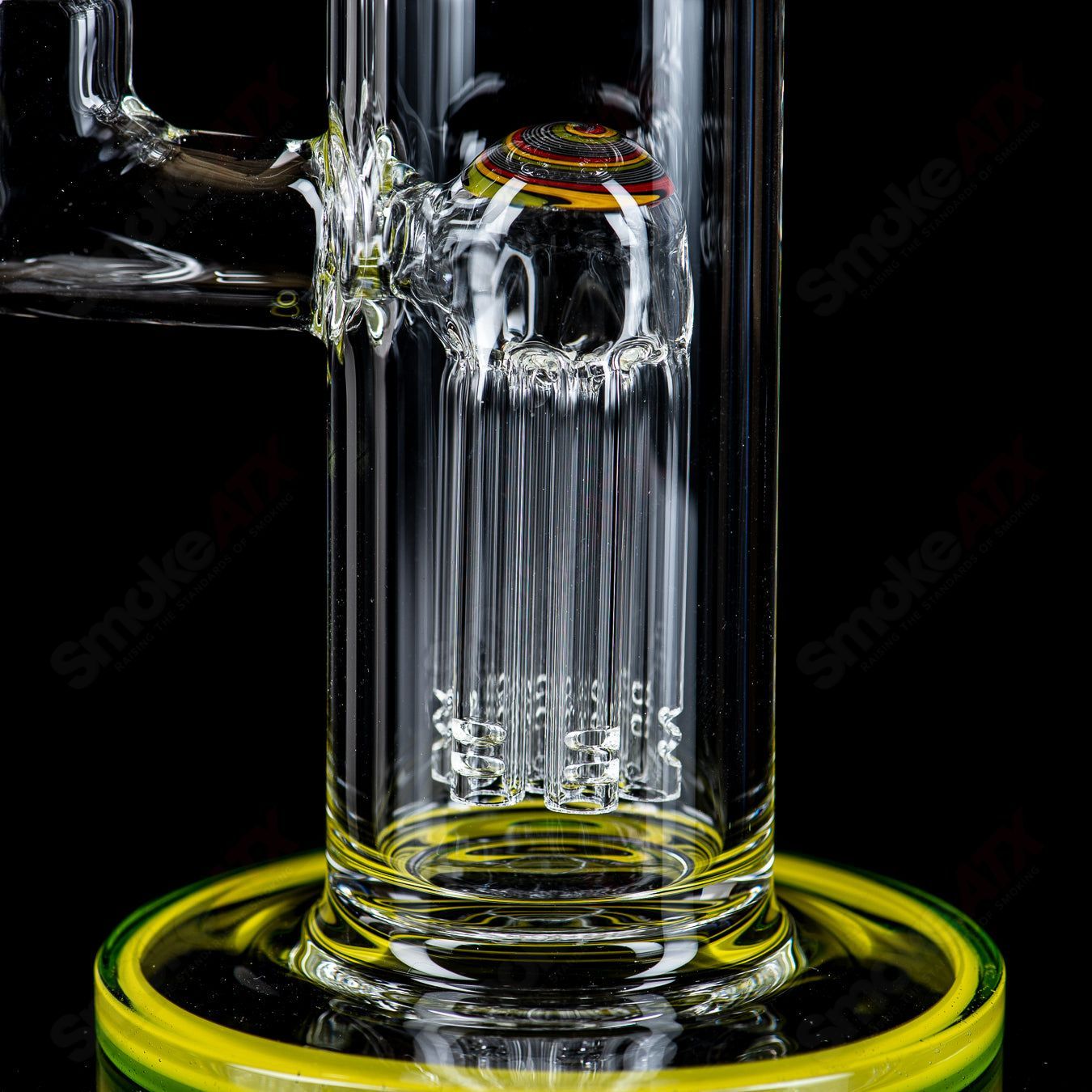 Toro Glass 14mm mini 7/13 arm perc straight tube with reversal sections, showcasing intricate glass design and clear construction.