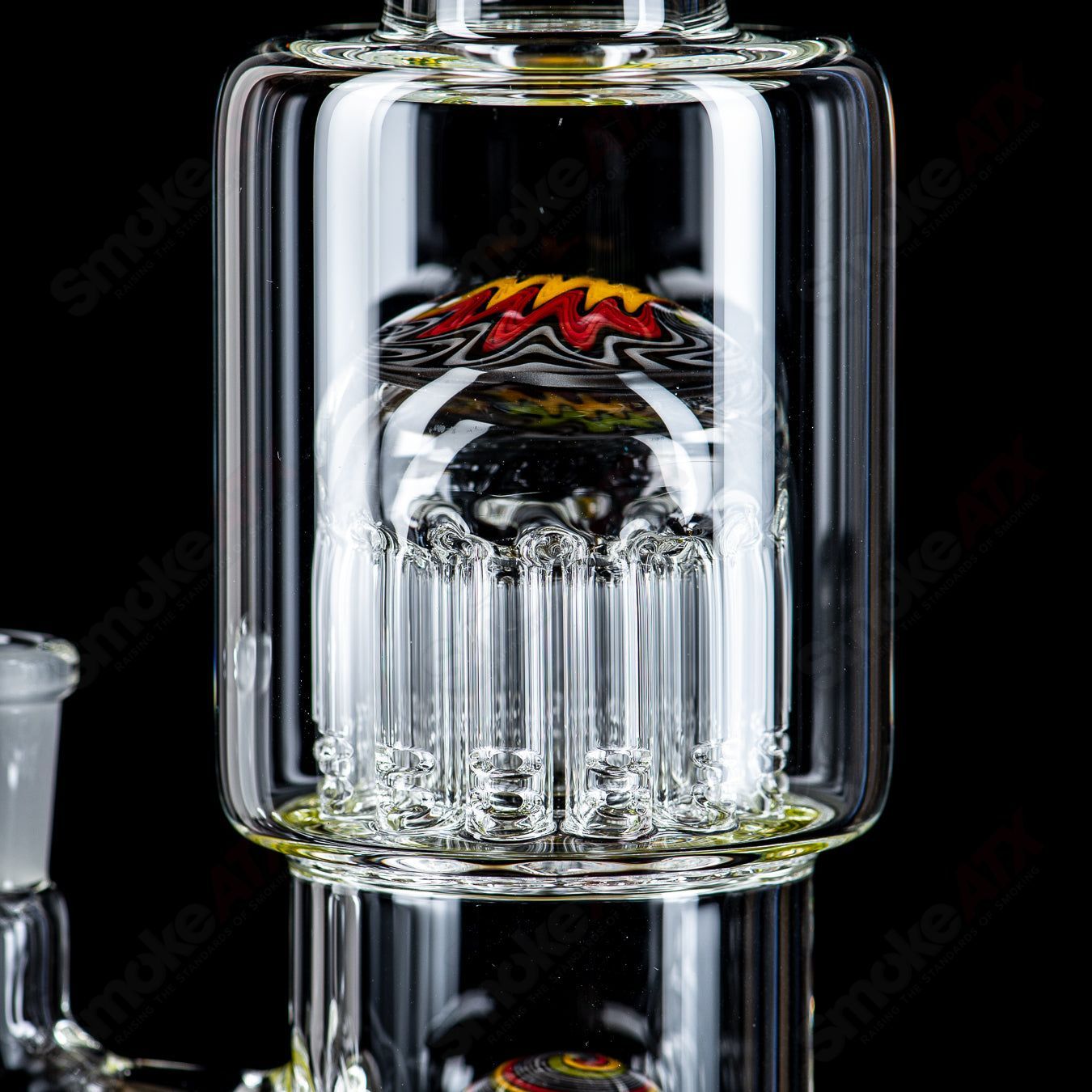 Toro Glass 14mm mini 7/13 arm perc straight tube with reversal sections, showcasing intricate glass design and clear borosilicate construction.