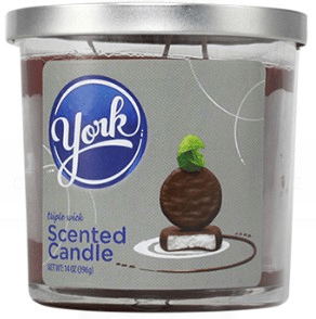 14oz Licensed Snacks scented candle in a glass jar with colorful snack-themed label, designed for aromatic ambiance.