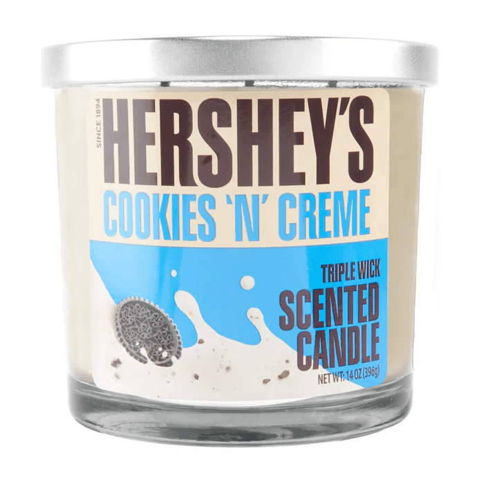 14oz Licensed Snacks scented candles in glass jars with colorful labels, designed for aroma and decorative use.