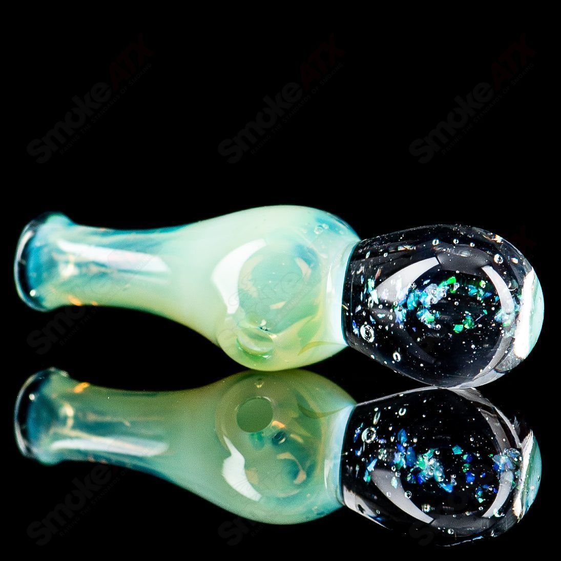 UV Puffco Joystick Indo heady glass Puffco top by Geoff Made Glass featuring vibrant UV-reactive design and intricate craftsmanship.